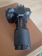 Vintage NIKON F70 35mm film SLR camera body only with strap for parts.