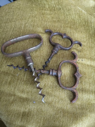 Three antique iron corkscrews