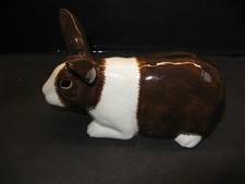 QUAIL CERAMICS DARK BROWN AND WHITE DUTCH RABBIT MONEY BOX