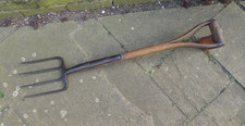 Vintage garden fork, border