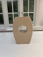 cream vase with a hole through the middle, rectangle shape, 40ish cm.