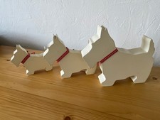 Trio of wooden scottie dogs