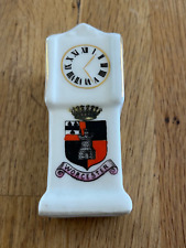 crested grandfather clock -