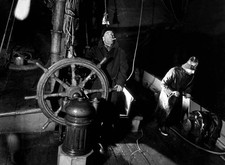 Skipper Harry Evans at wheel