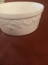 White Ceramic Round  Serving Dish With Embossed Pattern Of Leaves  Around Side