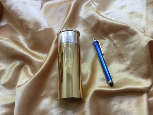 Chrome and brass shotgun