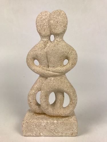Embracing stone sculpture - embracing,