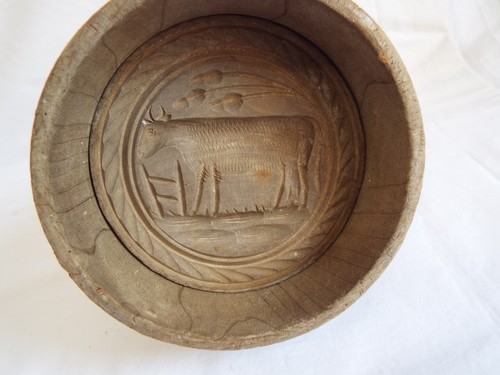 Antique carved wooden butter