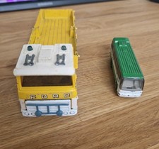 Two Old Fashioned Toy Cars. Ford Pick Up And City Line Bus