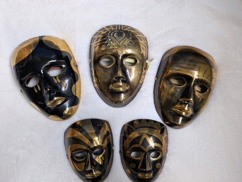 Vintage brass masks wall - masks,