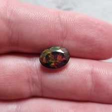Natural 1.65 ct Ethiopian black opal, 11.5x8.4x4.4 oval faceted