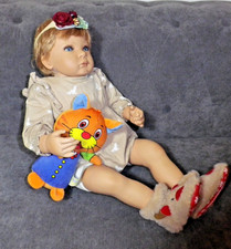 A beautiful little girl doll by artist Ruth Treffeisen for Ashton Drake