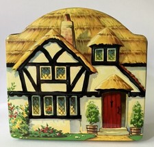 A Vintage Toffee Tin Thatched
