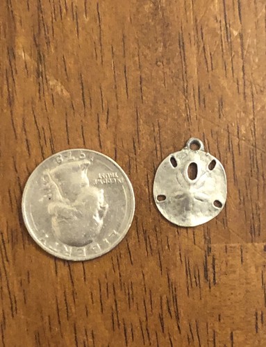 Silver tone sand dollar - tone,