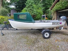 13 foot fibreglass fishing boat with 6 HP Honda outboard c/w road trailer