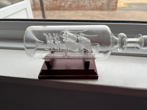 Glass ship bottle on - ship, a