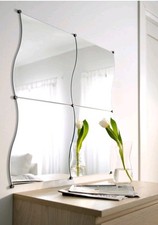 four Ikea wavy mirrors. Can be made up as a long mirror or square