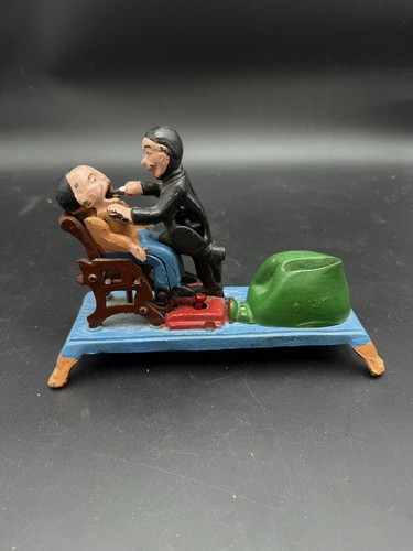 Vintage cast iron the dentist - cast,