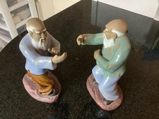 Pair Of Chinese Fighting Mudmen Figurines