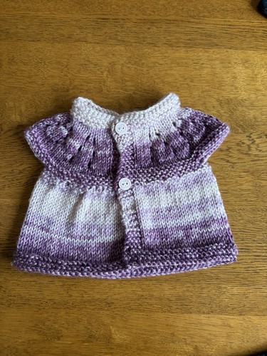 Hand knitted baby - hand,