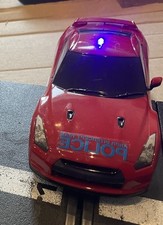 Scalextric- Red Nissan GT Police intercepter car with working lights