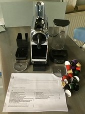 Nespresso Magimix Citiz Espresso Machine in a mirror like Chrome finish.