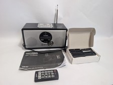 Technika DAB 407 fm radio alarm clock with iPod docking accessories.