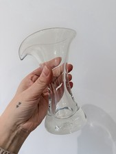 A clear glass vase designed