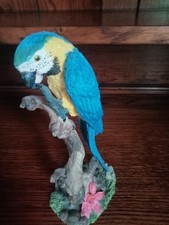 macaw parrot figure statue on tree blue & yellow macaw .