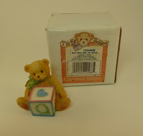 Bear with abc block - "q",