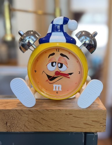 Yellow alarm clock - m&m,