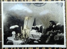 Boy mourns at the body of his dead baby sister. Vintage postcard Latvia