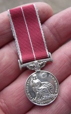 A PERIOD CONTEMPORARY MILITARY MINIATURE GRI BRITISH EMPIRE MEDAL, BEM.
