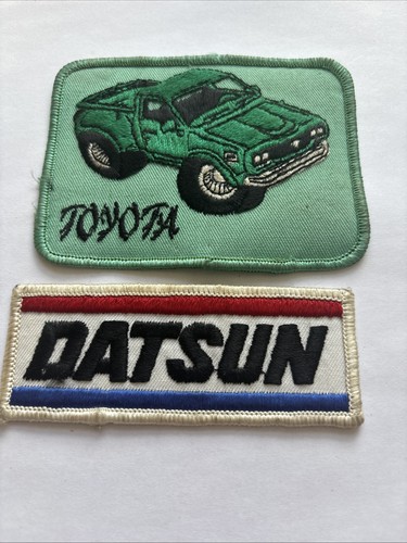 Two car badges datsun and - two,