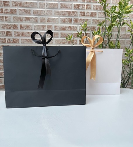 Plain white black ribbon - &,