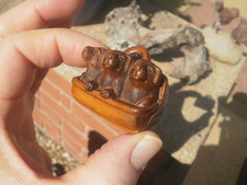 Hand Carved wood netsuke 3 puppy dogs in a bag, collectable boxwood figure