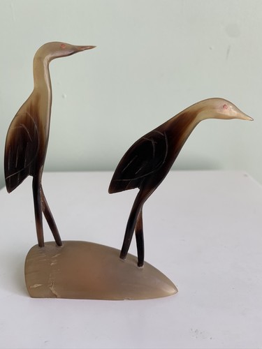 Hand carved horn bird pair - hand,