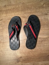 Gucci Kika GG Web Stripe Thong Sandal in black with a red and blue stripe Size 9
