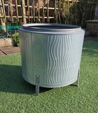 A LARGE FIRE PIT WOOD BURNER
