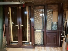 Brown UPVC French door with frame used as porch at front of house ideal DIY