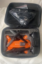 JJRC H109 orange RC drone with