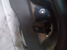 Front left door check - front,