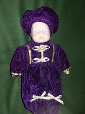 Porcelain Baby Doll in purple