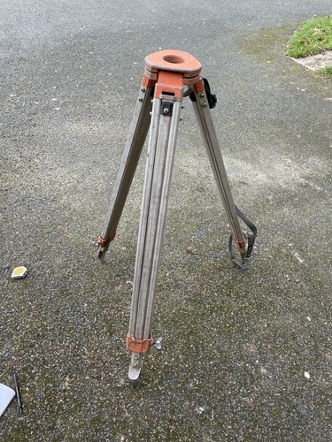 Surveyors extending tripod - surveyors,