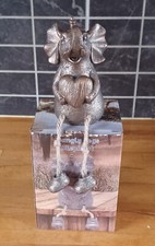 Tuskers elephant with string