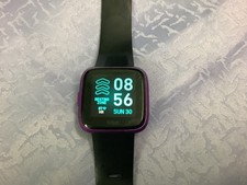 Fitbit versa lite edition - purple / black used with charger. Good battery life