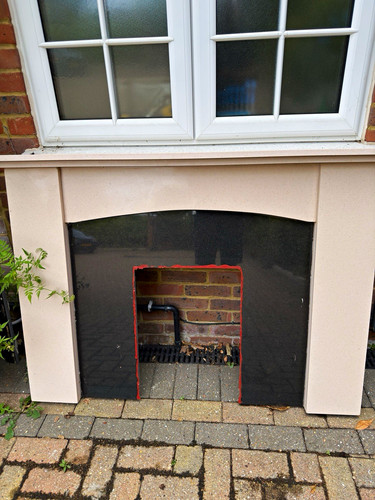 Beige stone fireplace surround - fireplace,