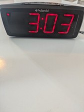 Polaroid Clock Radio. Black with Red LED display. Mains or battery operated. FM