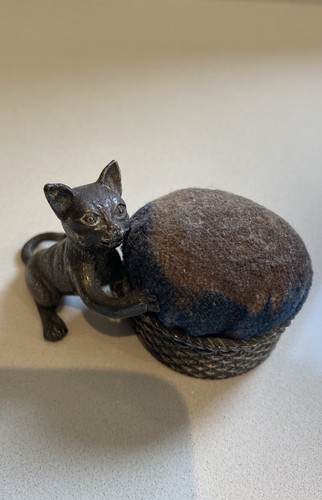 Vintage antique cat - holding, a