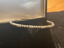 White Gold 18ct Sprung bangle with 15 natural diamonds. Unique design,elegant